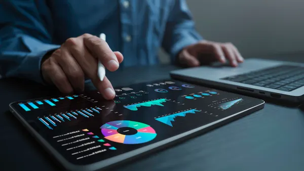 An analyst uses a computer and dashboard for data business analysis and Data Management System with KPI and metrics connected to the database for technology finance, operations, sales and marketing.