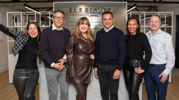 Employees at E.l.f. Beauty's London office at a grand opening event.