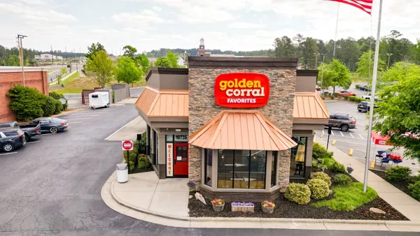 An aerial image of a brown building with a red and yellow logo that says "Golden Corral Favorites."