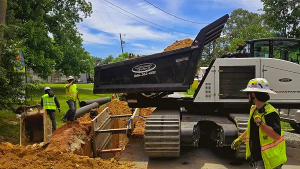 Crews work on a watermain extension project
