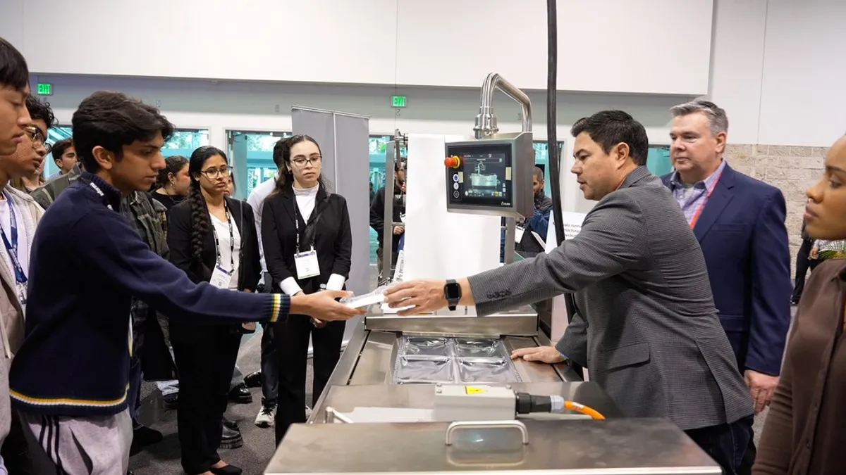 Students watch a demonstration at Informa Markets' student event during IME West.