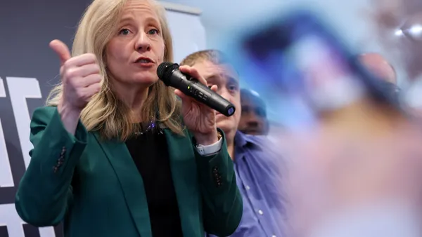 Governor-elect Abigail Spanberger speaks to supporters during a campaign bus tour stop at Railway Cafe on October 28, 2025 in Winchester, Virginia.