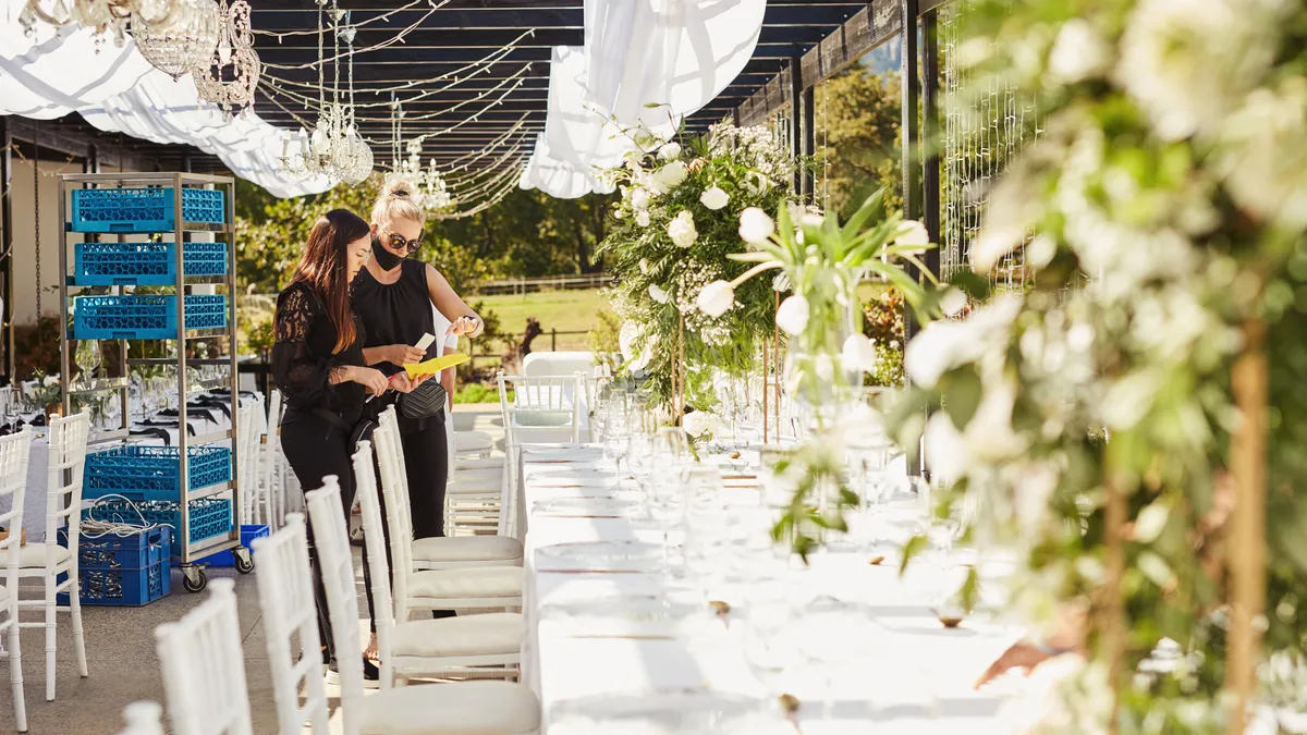 Two people look over a wedding venue