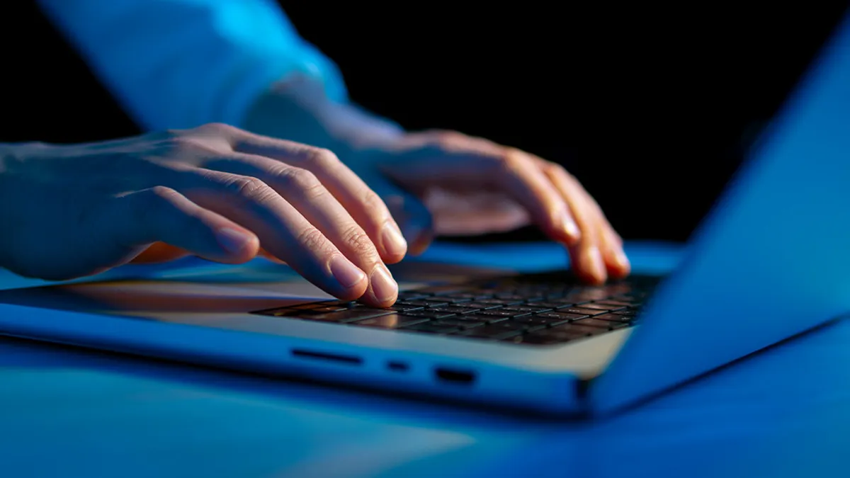 Someone using a laptop