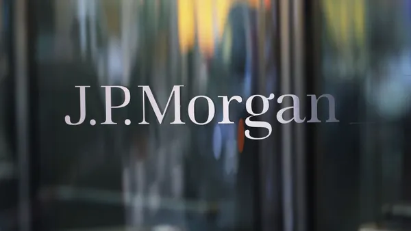 A close-up of the name "J.P. Morgan" is shown on a glass door.
