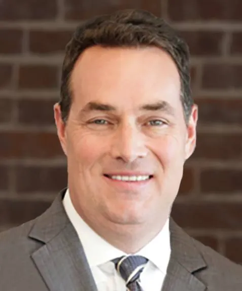 headshot of Ken Cleary, CFO of Schiolastic