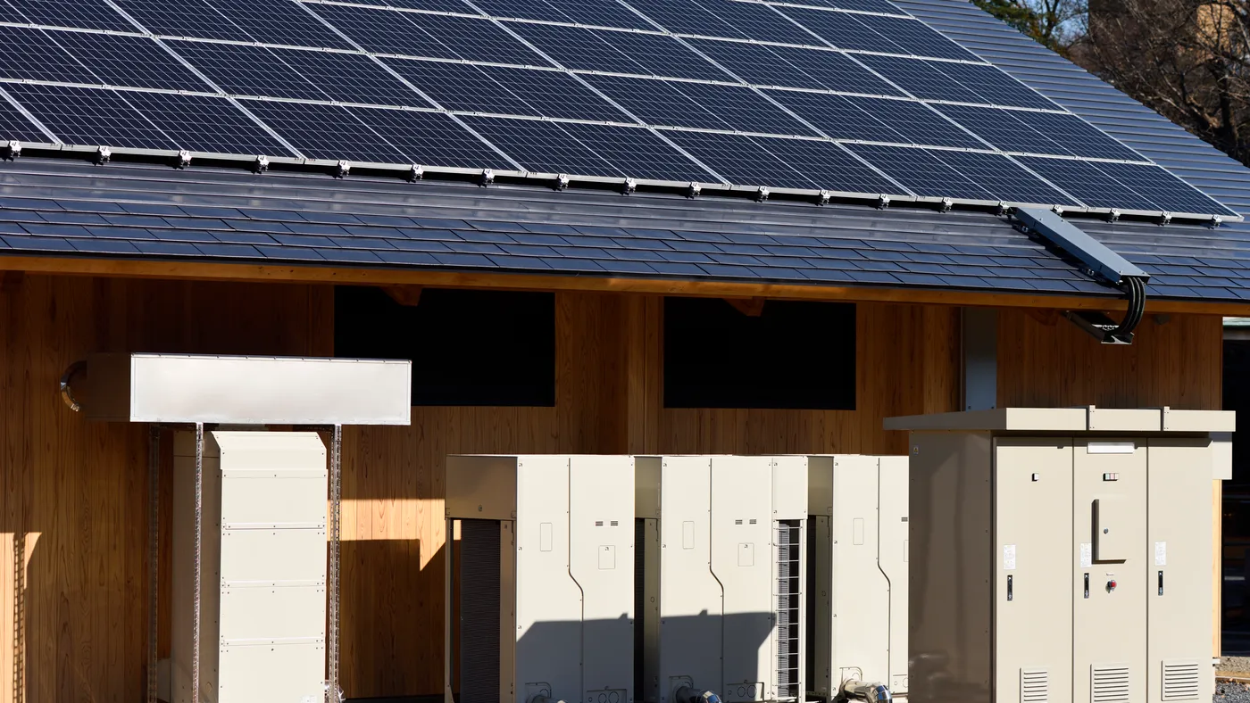 Photovoltaic cells and battery systems on a building.