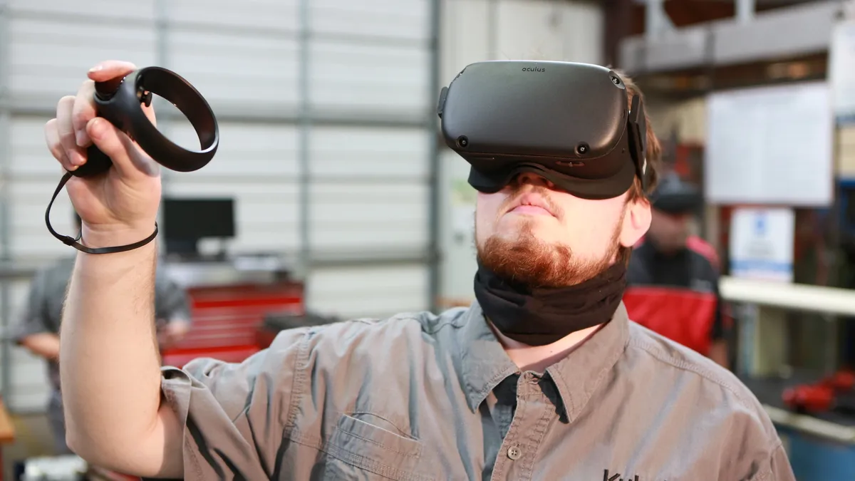 A student at Wallace State Community College uses virtual reality to learn how to be a diesel engine technician.