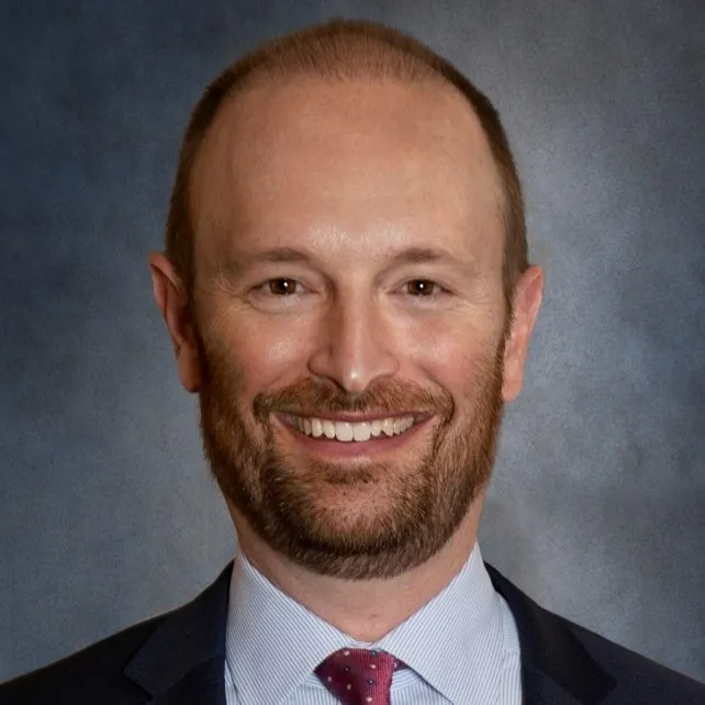 First Bank Chairman Mike Dierberg is shown wearing a suit