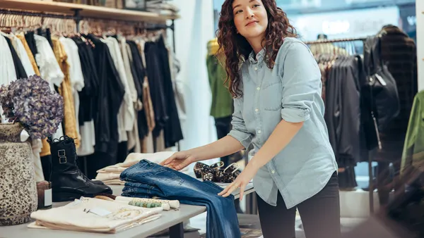 person folding clothes