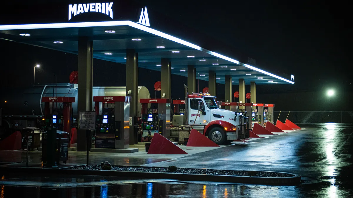 A photo of a tanker truck fuelling up at a Maverik.