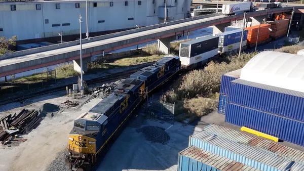 A CSX locomotive pulls the first double-stacked container train from the Port of Baltimore on Oct. 28.