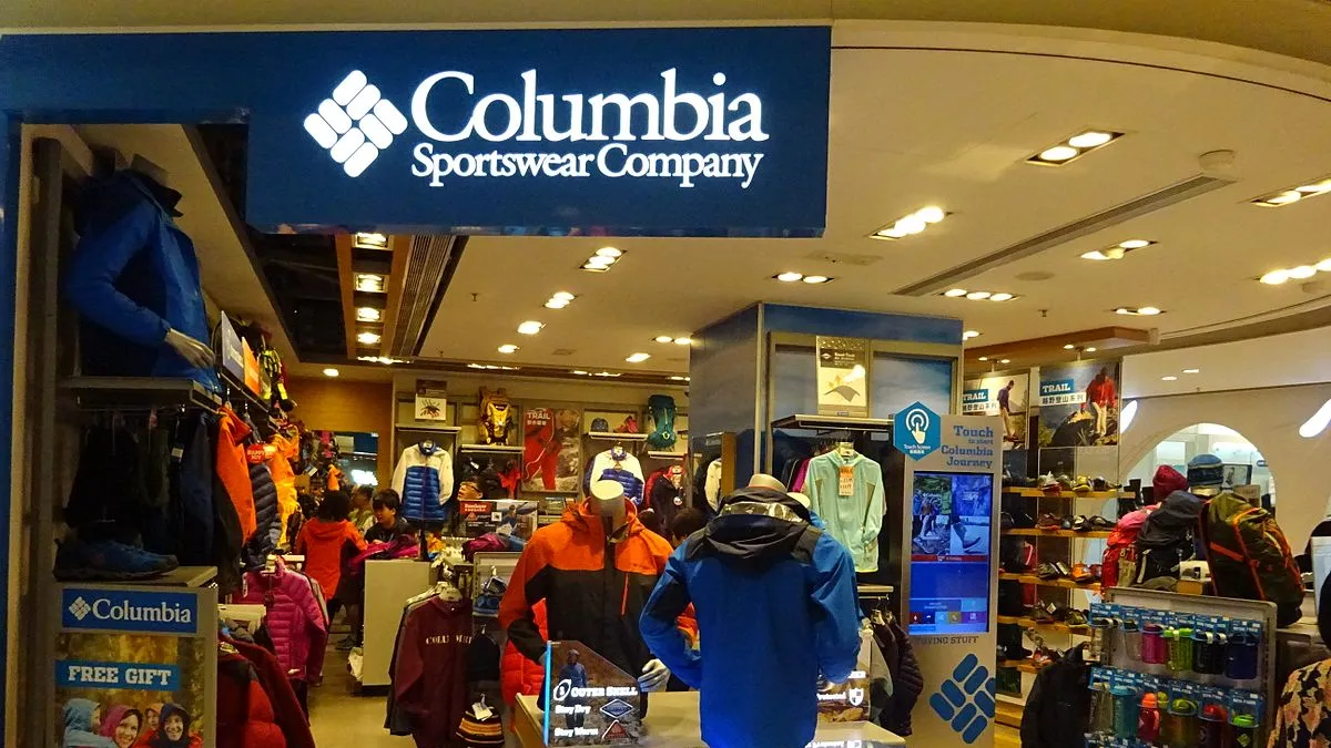 A Columbia Sportswear store is pictured, showing mannequins wearing rain jackets and a shelf of water bottles, among other products.