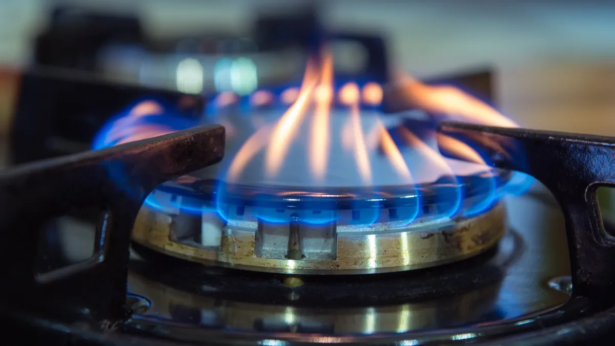 Close-up of lit gas stove.