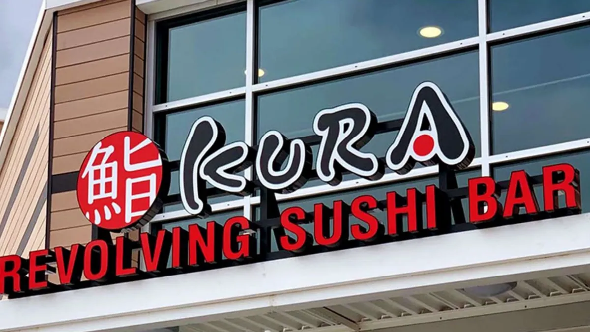 An image of a building with a sign that says Kura Sushi