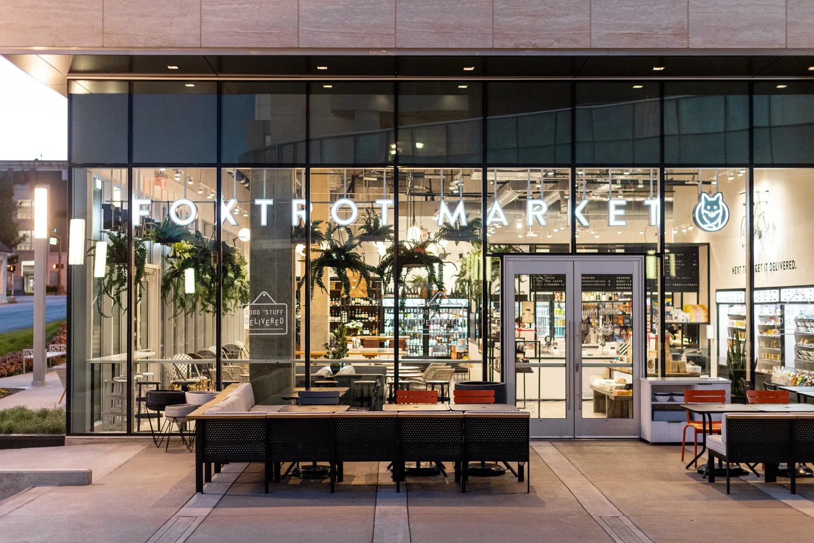 A photo of seating outside a Foxtrot c-store.