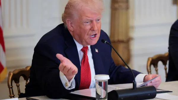 President Donald Trump speaks in the East Room of the White House.