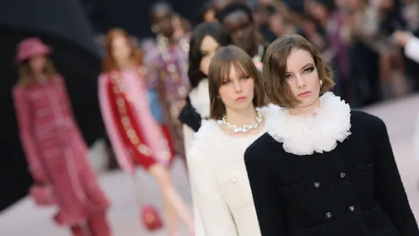 Models walk in a straight line down the runway.