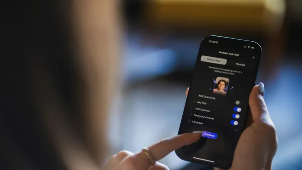Hands holding a phone while the user scrolls