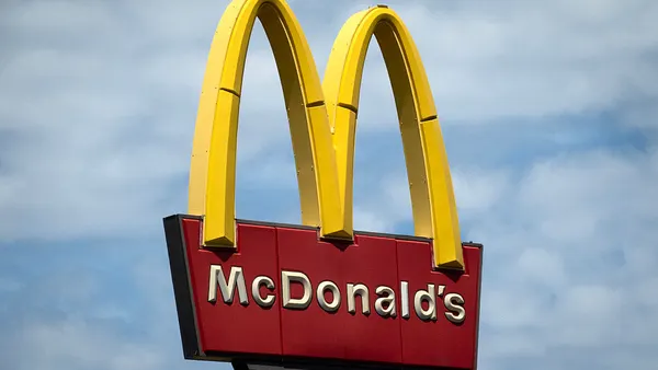 mcdonalds signage against a blue sky