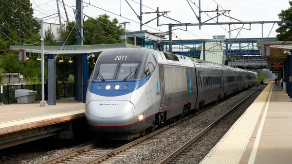An Amtrak Acela train stops at the Route 128 station in Massachusetts.