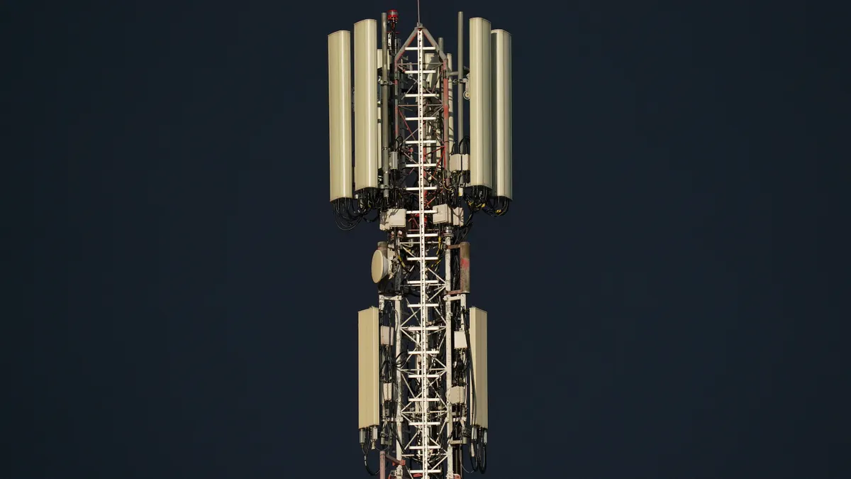 A cell tower is seen in a close-up shot