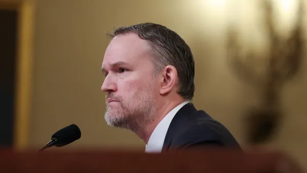 U.S. Trade Representative Jamieson Greer sits in front of a microphone while testifying before the House Ways and Means Committee.