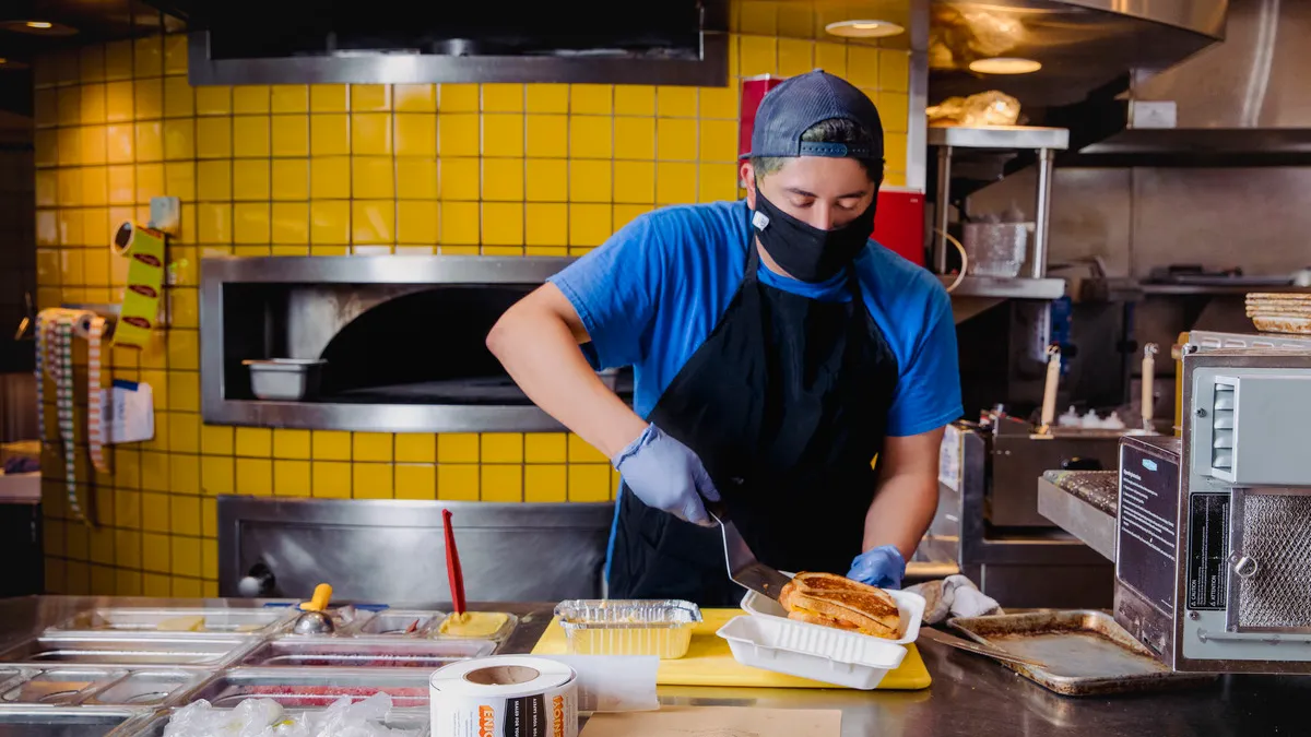 A DoorDash Kitchens chef prepares a meal inside the DoorDash Kitchen San Jose.