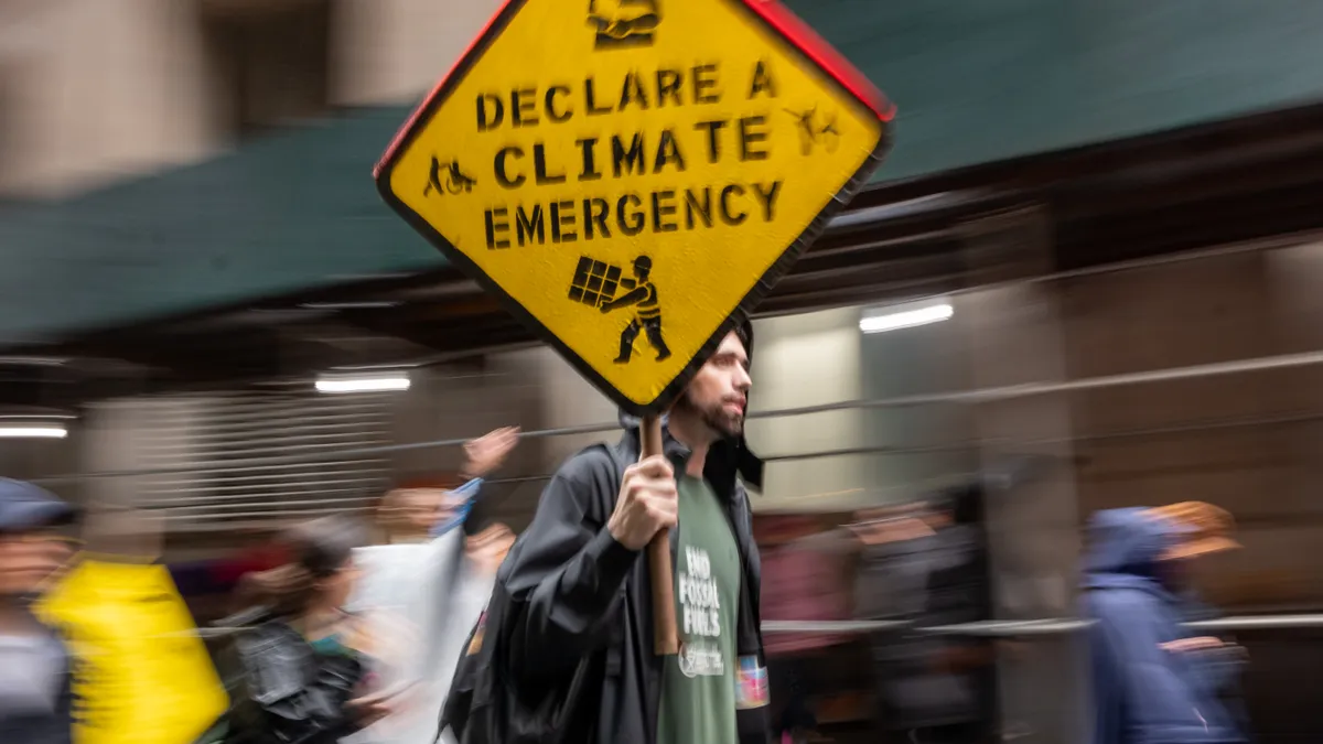 Climate protester holds up a sign during a demonstration.