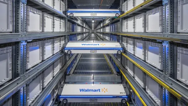 Walmart and Knapp-branded storage systems with wheels are in a warehouse.
