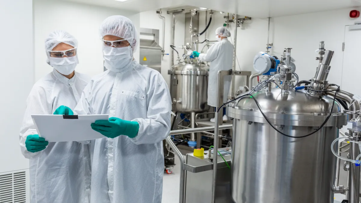 Employees of CureVac work in a laboratory