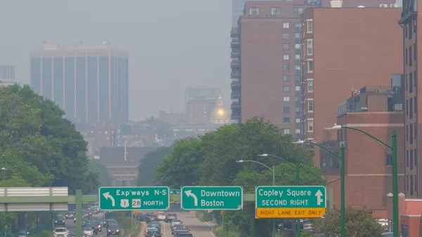 Wildfire smoke obscures the Massachusetts State House and surrounding areas in Boston.