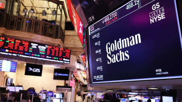 The Goldman Sachs company logo is displayed on a screen at the New York Stock Exchange during afternoon trading on August 02, 2024 in New York City.