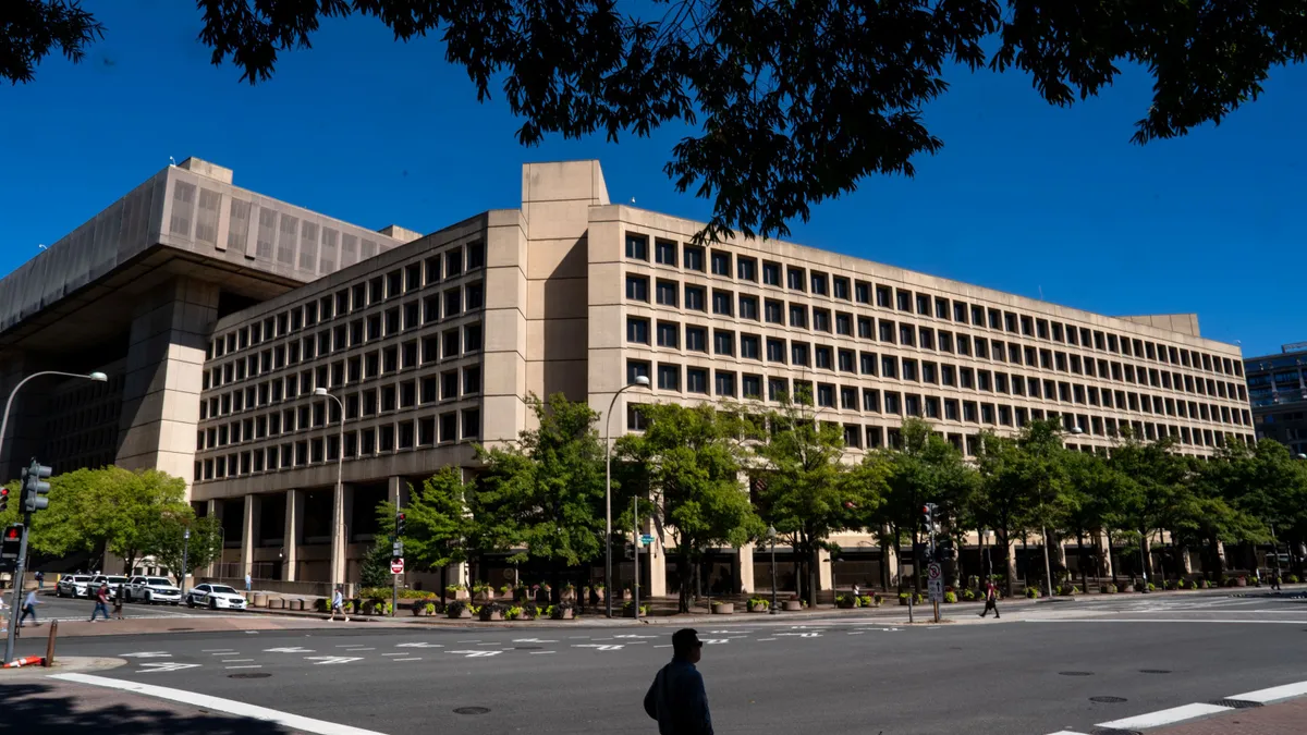 An office building seen from ground level across the street.