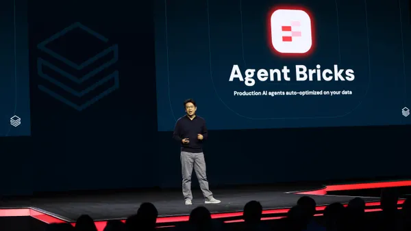 Hanlin Tang, CTO of neural networks at Databricks, speaks on stage at the data an ai platform company's annual conference.
