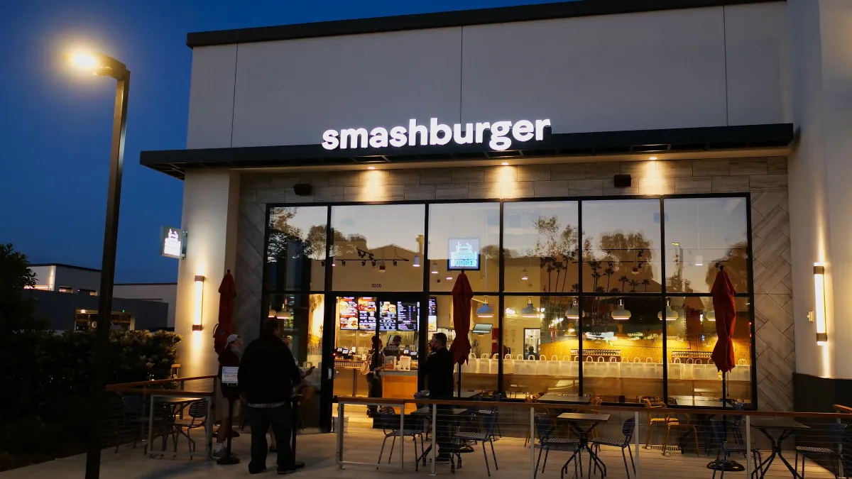 An image of a Smashburger restaurant in the evening light