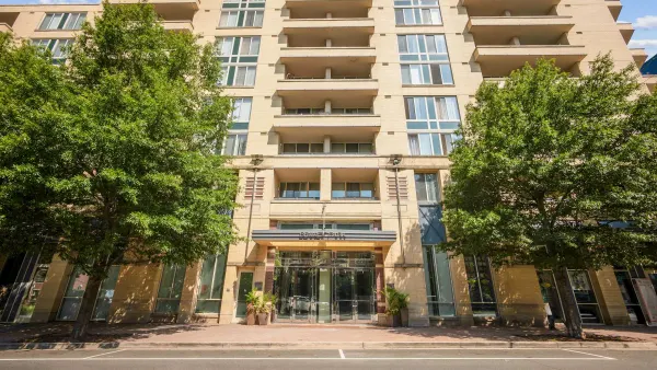Ground view of brick high-rise apartment building
