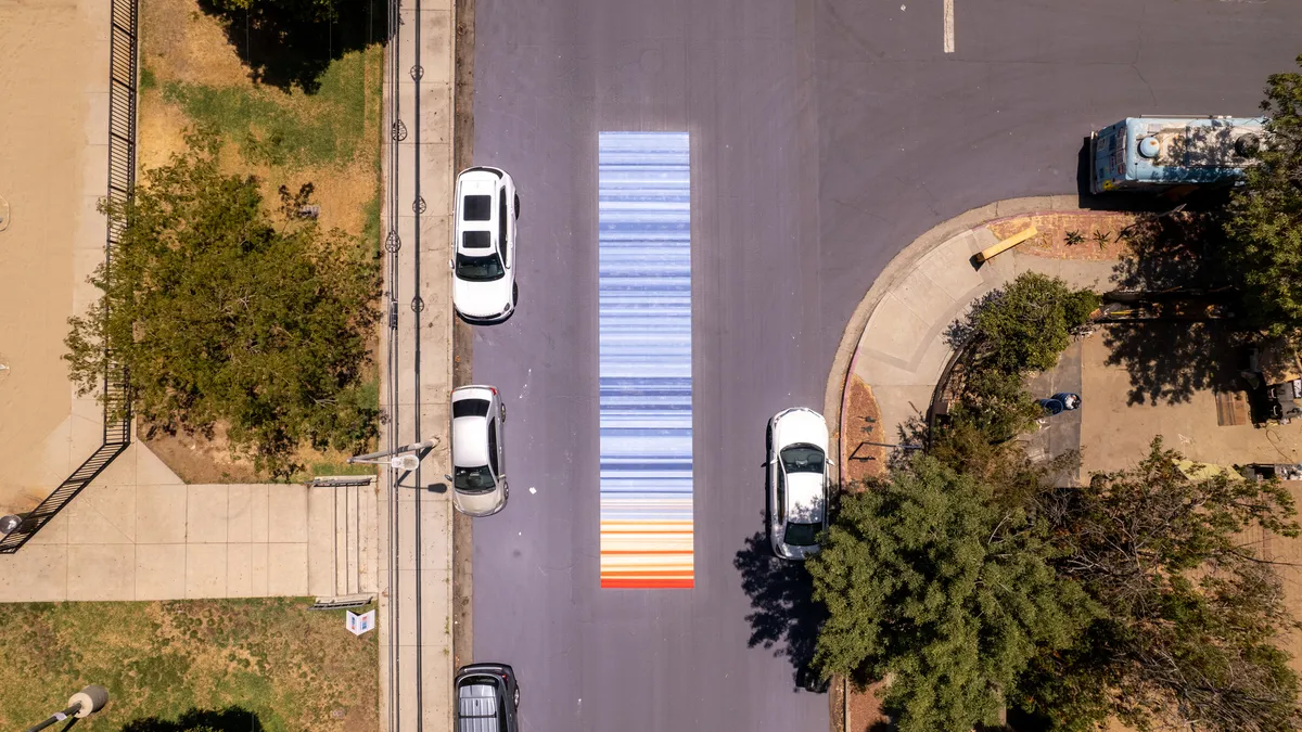 Aerial shot of red and blue stripes painted on a street