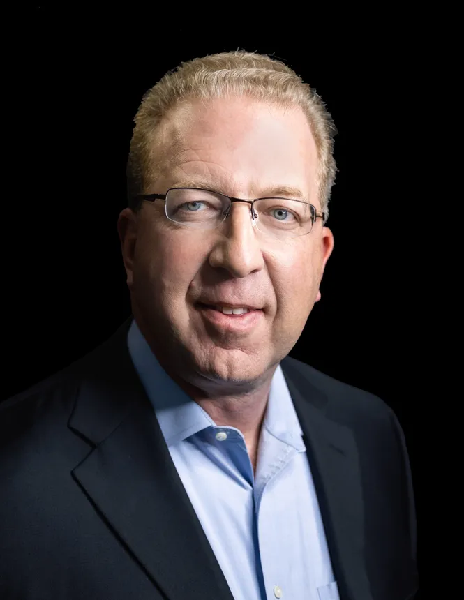 A headshot of Savana CEO Mike Wolfel.