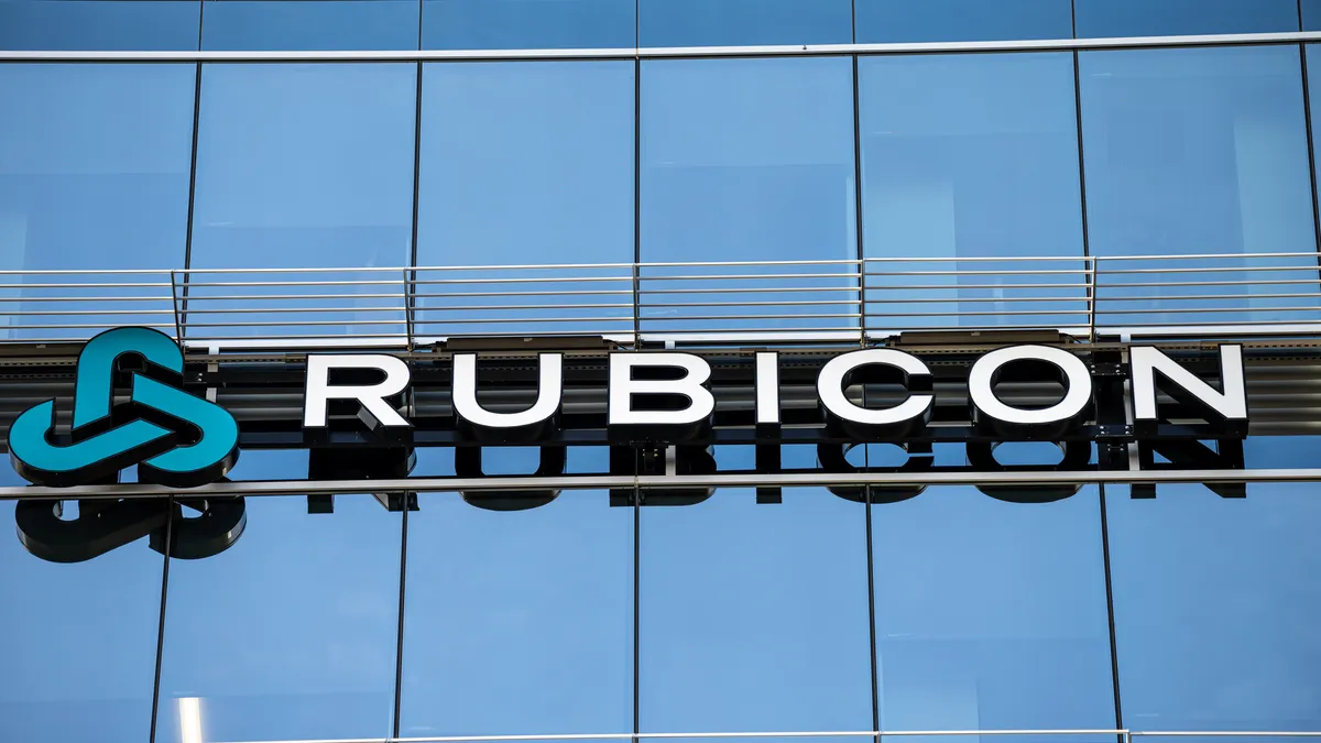 Exterior of glass-walled office building with letters spelling "Rubicon"