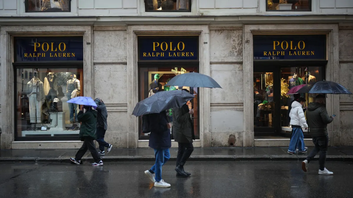 Shoppers walk past the U.S.-owned Polo Ralph Lauren store in the upmarket Via del Corso shopping area on March 12, 2025 in Rome, Italy.