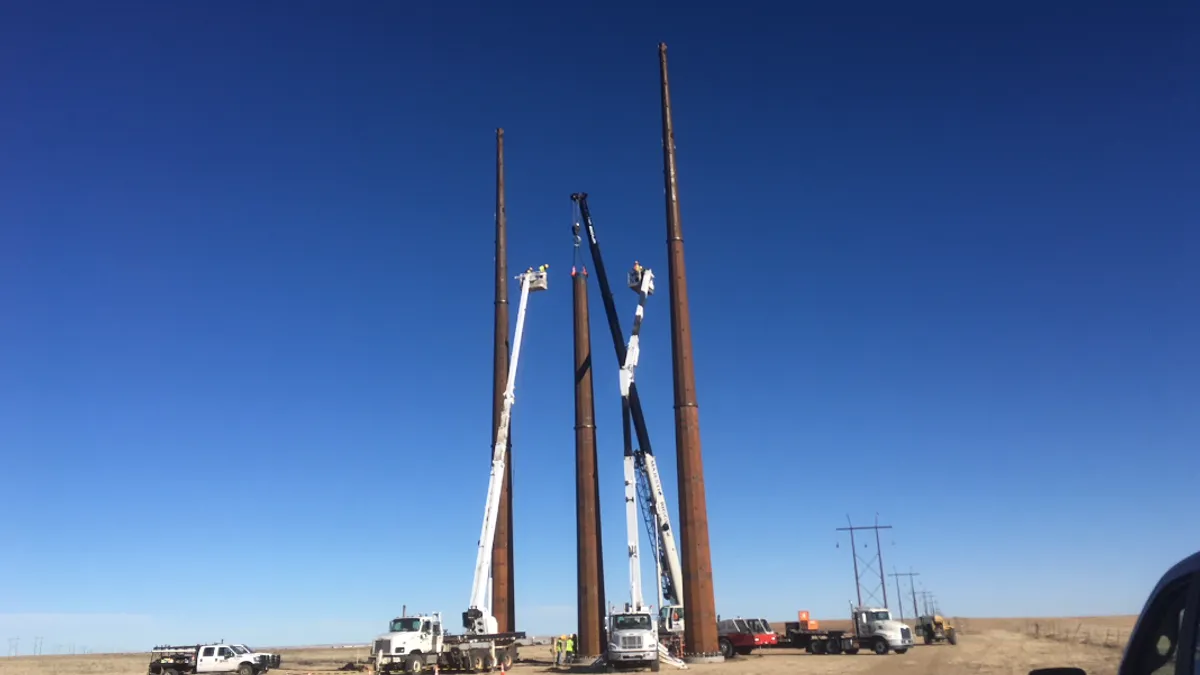 A structure is set on Xcel Energy's Rush Creek transmission project in Colorado.