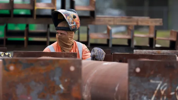 A construction worker helps build the Signature Bridge on January 5, 2024, in Miami, Florida.