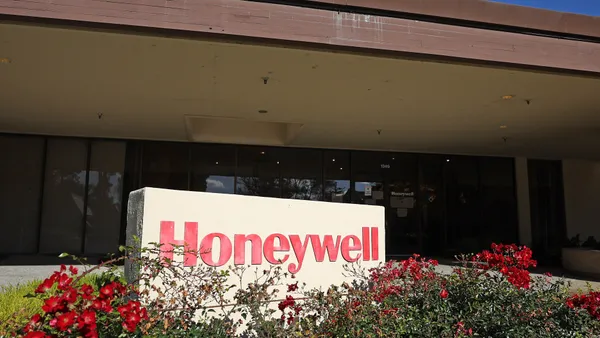 A Honeywell sign is posted in front of an office building.