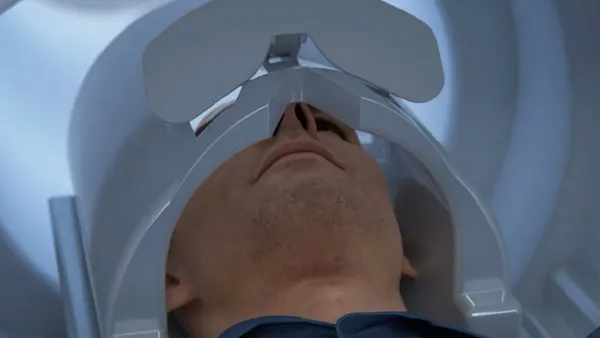 A person head is shown inside GE Healthcare's Signa Magnus MRI machine.