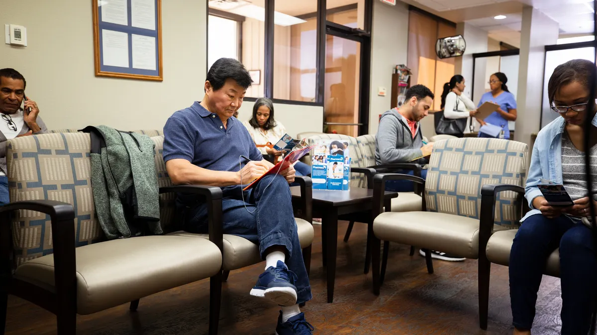 Many people wait in the busy day surgery waiting room.