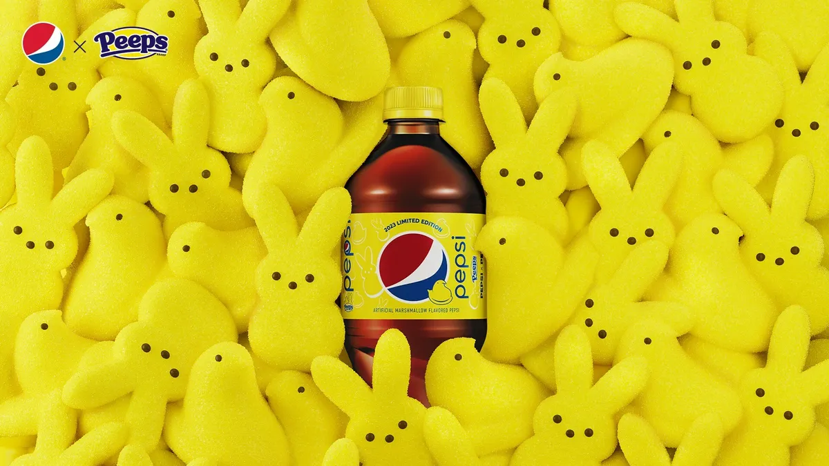 A bottle of Pepsi and Peeps soda surrounded by yellow Peeps bunnies.