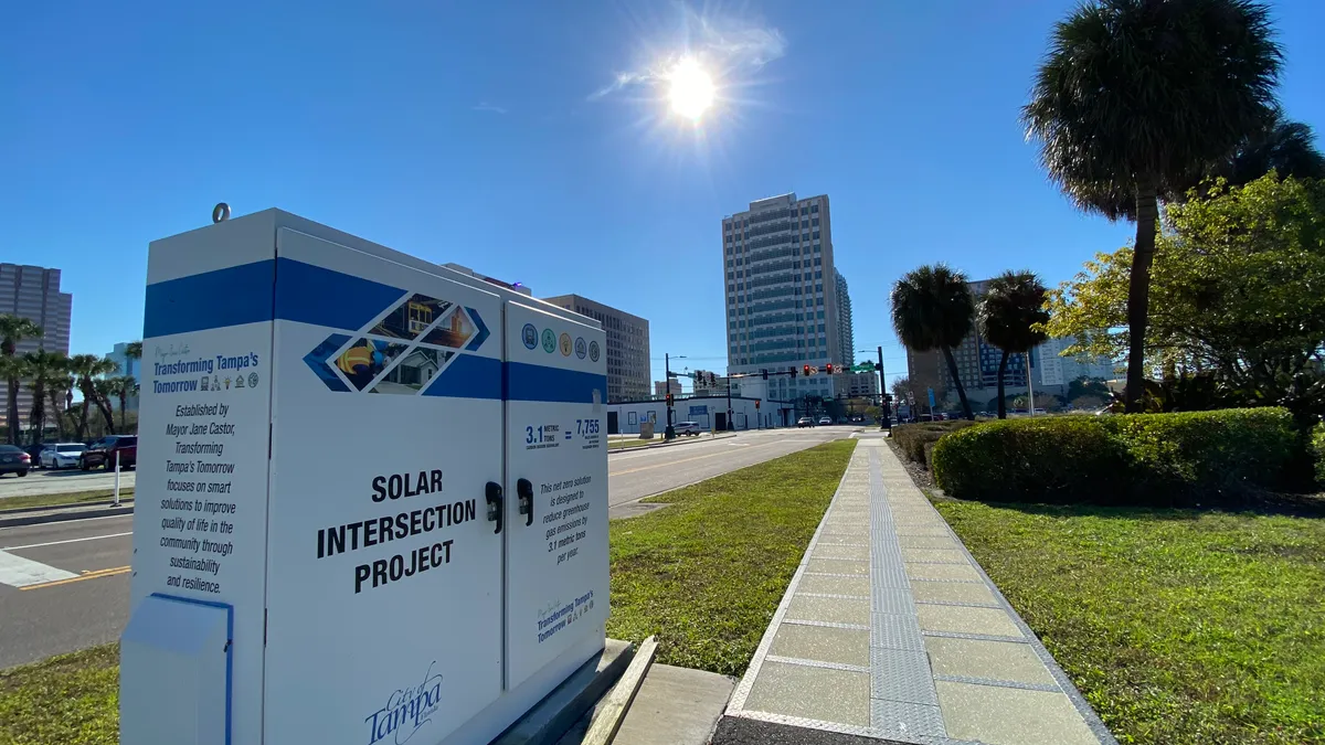 A sidewalk in Tampa, Florida, with embedded solar panels designed to help power traffic lights at an intersection.