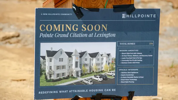 Sign with a rendering of the upcoming Pointe Grand Citation at Lexington development at the groundbreaking event.