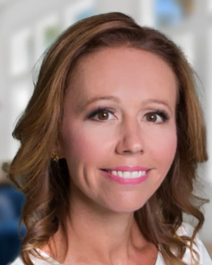 Headshot of a woman in business attire.